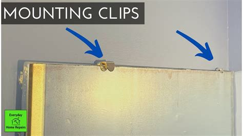 how to remove a large mirror mounted with metal brackets|how to remove mirror clips.